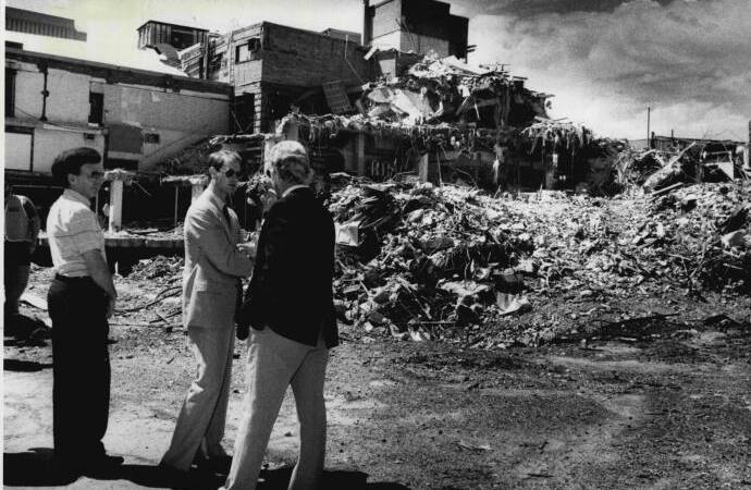 ROYAL FLUSH: Peter Barrack with Prince Edward, Earl of Wessex, and Wayne Dean, Newcastle Workers Club secretary manager, survey the demolished club site in early 1990, shortly after the December 28, 1989, earthquake