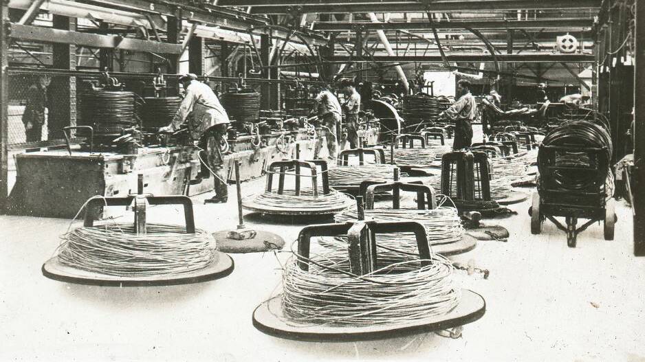 Wire drawing at Ryland Bros, Newcastle, pre 1940. Image courtesy of University of Newcastle Cultural Collections, originally donated by Mr E. Braggett in 1975.