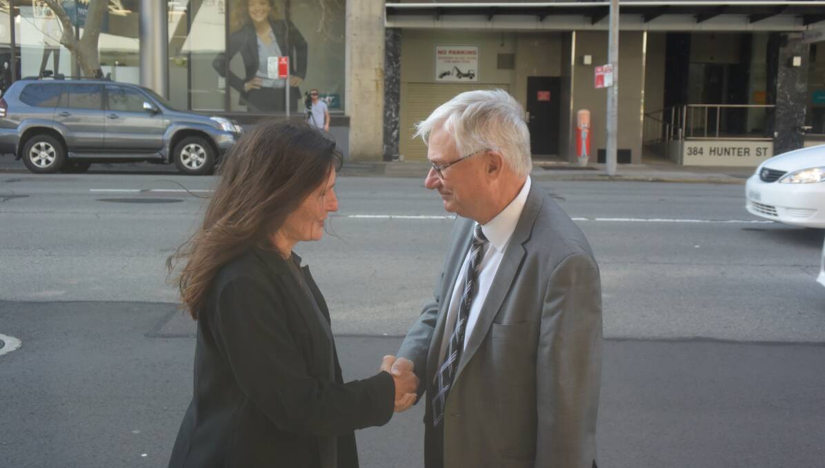 A JOB WELL DONE: Joanne McCarthy and the chairman of the Royal Commission, Justice Peter McClellan, exchange a few quiet words in Hunter Street, Newcastle, after the completion of the Maitland-Newcastle Catholic hearings on Thursday, September 8, 2016.