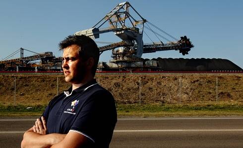 FIGHTING FOR JOBS: Daniel Wallace in 2012, before his election as trades hall secretary, outside the Newcastle Coal Infrastructure Group coal loader on Kooragang Island.