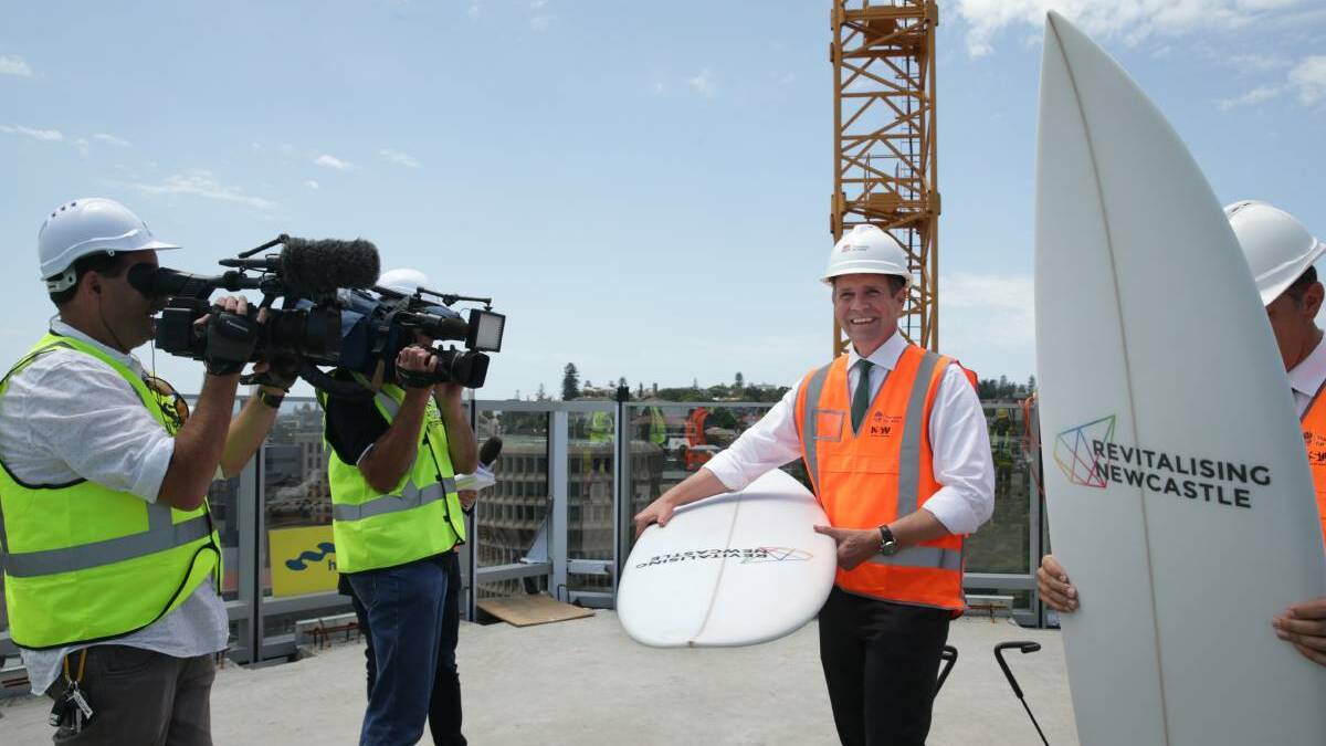 PREMIER'S PROMISES: Mike Baird, who championed the plans to 'revitalise' the city, on top of the university's NUspace building in Hunter Street.