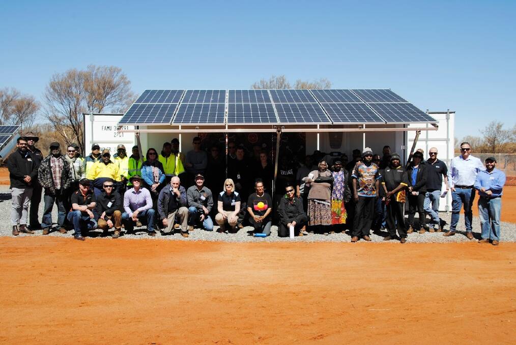 DESERT DROPS: Members of the Gillen Bore community with their Gilghi Remote Water System, one of the modular products produced by Ampcontrol, and an inspiration, Mr van Haren says, for the modular construction planned for the new LeoLabs radars. Picture: Ampcontrol/LeoLabs