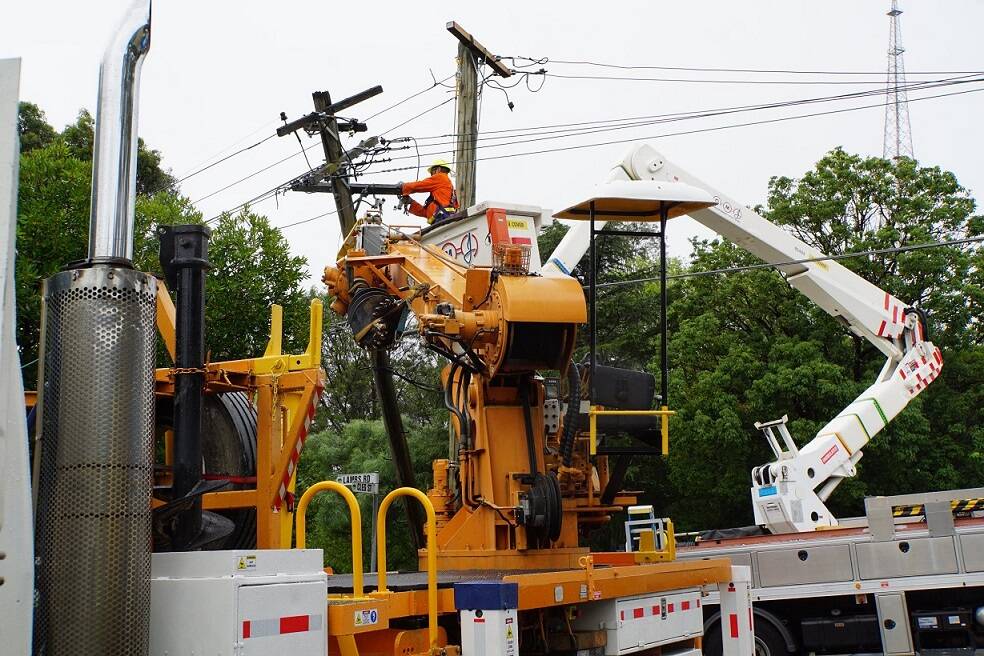 BIG JOB: Ausgrid repairing damaged powerlines after a storm in February. Picture: Ausgrid