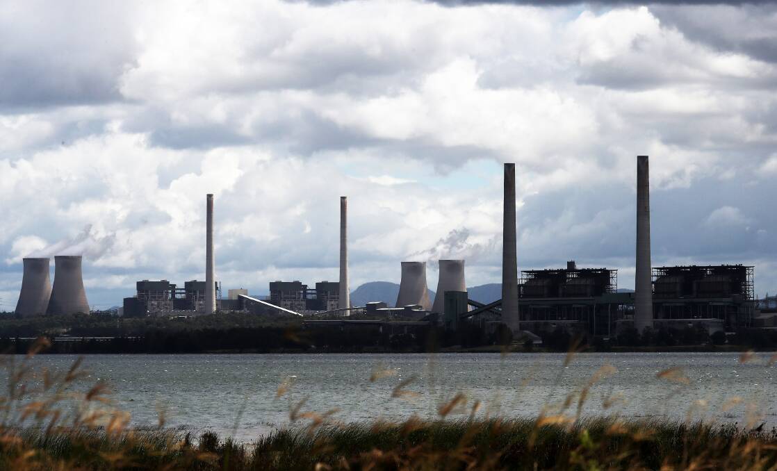 TARGETS: Liddell power station in the foreground, with Bayswater and its four cooling towers behind. Picture: Peter Lorimer