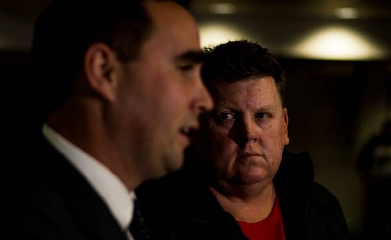 Adero principal Rory Markham announces the class actions against Mount Arthur contractors TESA and Chandler Macleod, with lead claimant Simon Turner. Picture: Simon McCarthy.