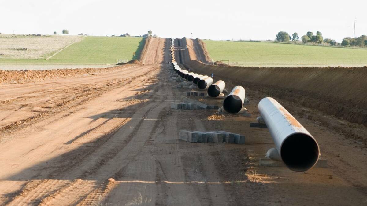 UNDERGROUND: A section of Moomba to Sydney gas pipeline being laid. Mr Simonian says a Hunter Gas Pipeline would disturb a similarly narrow strip of land, before being buried.