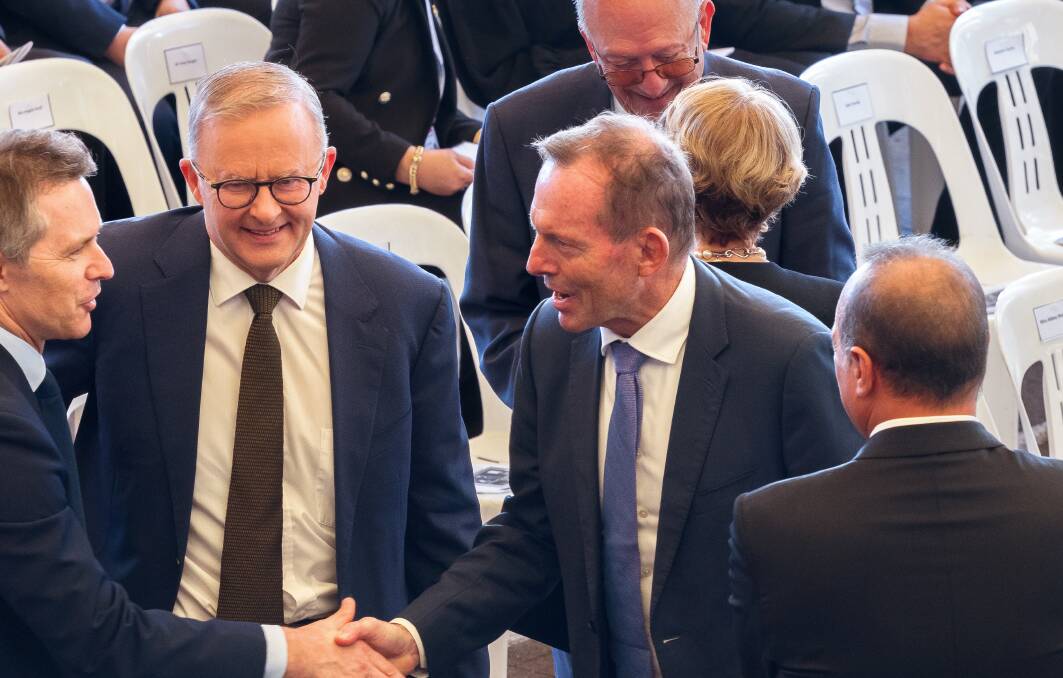 CLOSE CONTACTS: Mr Albanese smiles on as former Liberal PM Tony Abbott shakes hands with Labor's Jason Clare at a Good Friday service at Monastery of Saint Charbel Lebanese Maronite Order, in Punchbowl. Picture: Sitthixay Ditthavong