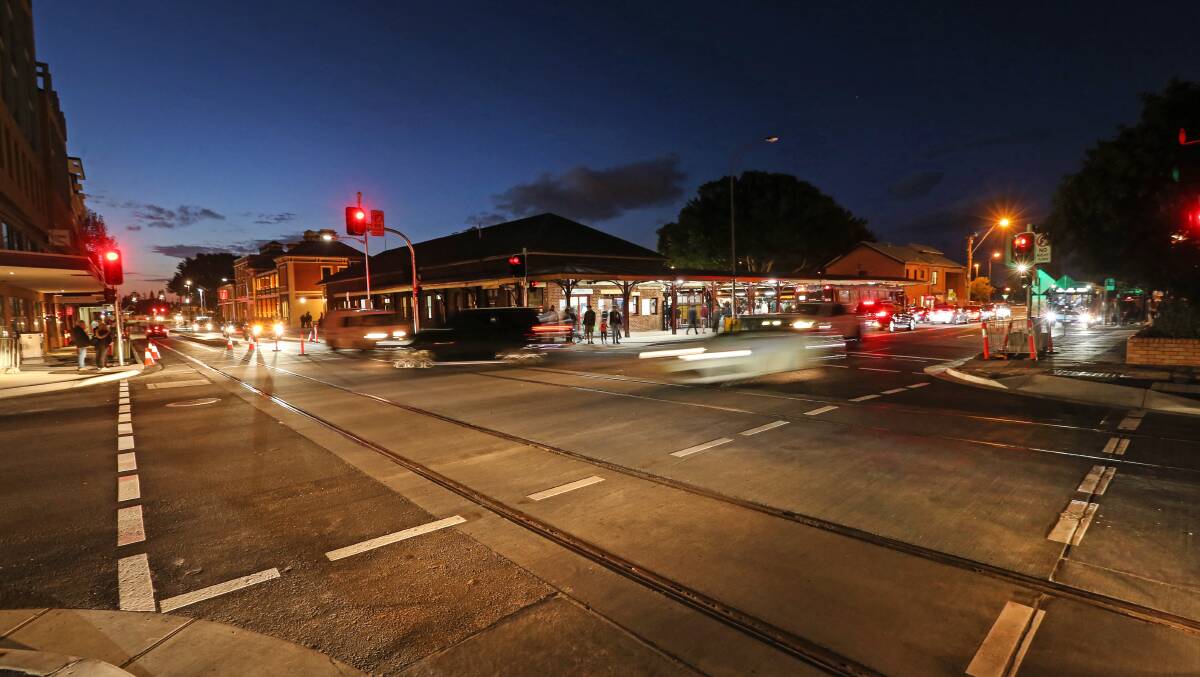 COLOUR AND MOVEMENT: After more than a year of construction disruption, Hunter and Scott streets are open again. Outside 'The Station' on Saturday nigh. Picture: Marina Neil