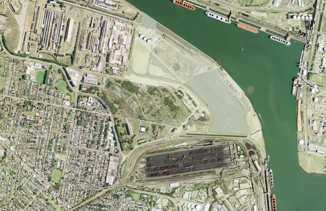 AS IT IS TODAY: Satellite view of the former steelworks site, showing the delineation between the waterfront Port of Newcastle land and the Intertrade site immediately north of the coal loader and fronting Industrial Drive. Picture: SIX Maps, NSW government