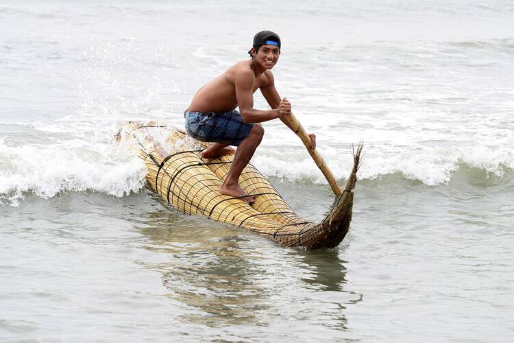 THREE MILLENIA: Riding a caballito de totora, the craft made of bound reeds and virtually unchanged from similar craft found on ancient South American pottery. Picture: Courtesy Surfer Today magazine