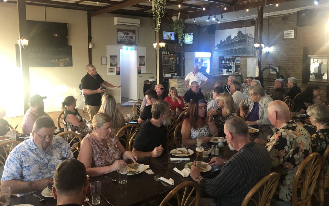 AS THEY WERE: Stuart Bonds, standing in black shirt, speaks at an electoral fundraiser in Cessnock in January, with the guest speaker, Queensland One Nation Senator Malcolm Roberts, looking on, standing at the rear in white.