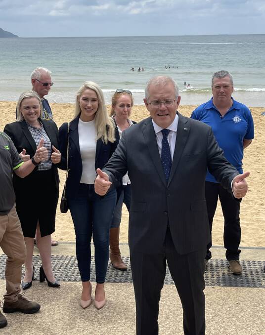 ALL OVER NOW: Prime Minister Scott Morrison at Terrigal Beach on Thursday morning announcing his government's plans to refuse a renewal of the PEP-11 gas exploration area off the NSW coast. With him are the Liberal candidates for Shortland, Nell McGill,and Paterson, Brooke Vitnell, as well as representatives of The Wilderness Society and the Terrigal and Avoca SLSCs.