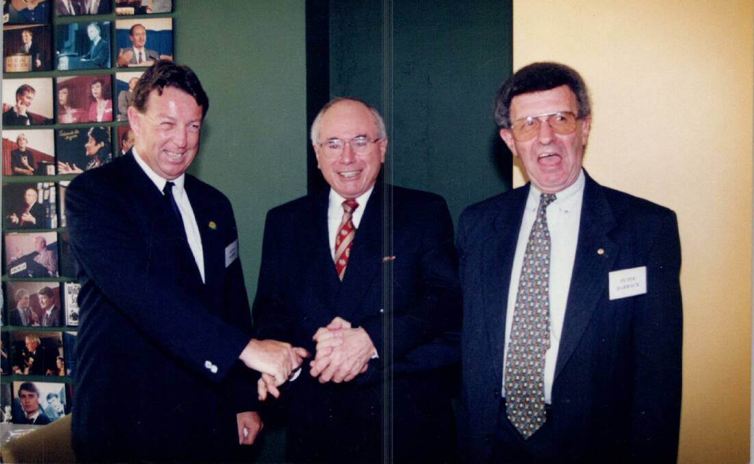 A RARE moment in history. Kevin Maher, AWU secretary, Liberal PM John Howard and Newcastle Trades Hall Council secretary Peter Barrack. Picture: AWU BHP closure archive