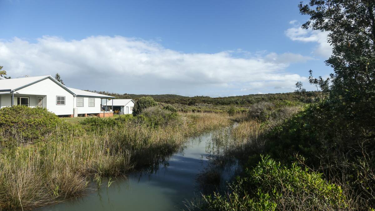 A Catherine Hill Bay house next to the creek that runs into the lagoon.