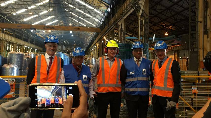 NEW FUTURE: Sanjeev Gupta, in the yellow hard hat, with other executives at the Mayfield plant in 2017, soon after his companies bought OneSteel out of administration.