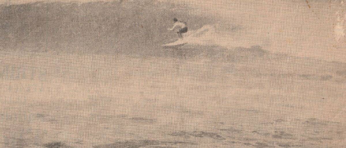 SURFRIDER: A mid-1960s newspaper photo of an unnamed surfer that Merewether Surfboard Club says of Jim McInnes. The picture was captioned: "While most people stayed indoors out of the biting wind, intrepid surfboard riders braved both the wind and the water to compete in the Newcastle Surfboard Association teams championship at Merewether. This surfrider crouches to escape the falling curl and trims his board for maximum speed.' Merewether won for the third consecutive year.' Picture: Merewether Surfboard Club