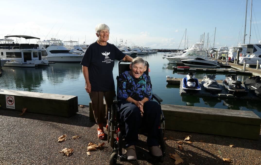 ALWAYS HAPPY: Marea Bourke with her sister-in-law Judy Bourke at Nelson Bay in April. Marea was known around the world in the Angelman Syndrome community as its oldest living member. Picture: Jonathan Carroll