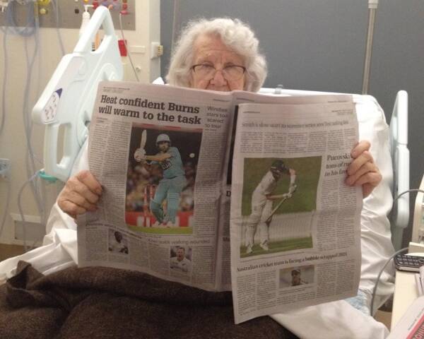 NINETY-FOUR NOT OUT: Audrey in hospital with the Herald and the cricket coverage.