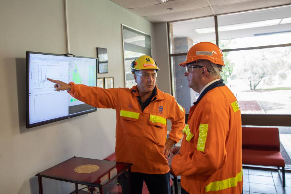 CHARTING A COURSE: Tomago Aluminium chief executive Matt Howell with federal Labor opposition leader Anthony Albanese on a recent tour of the smelter, pointing out the amount of power the smelter could consume in normal operation.