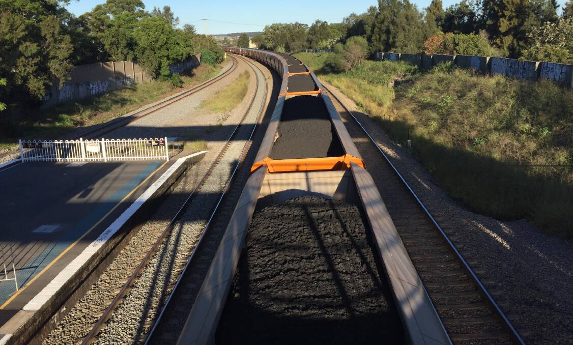 IN TRANSIT: Coal being hauled through Maitland on its way to Newcastle.