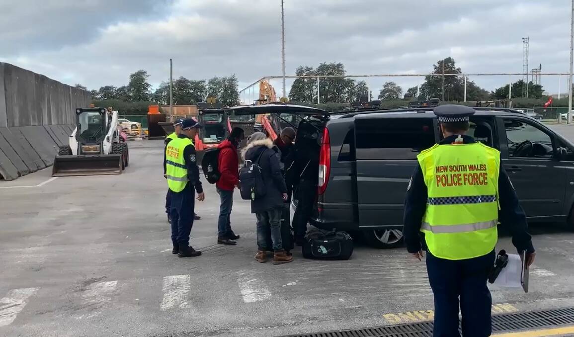 DRY LAND AT LAST: Crew of Unison Jasper, who the International Transport Federation says have been at sea for 14 months without a break, preparing to be driven to Sydney on Friday afternoon for COVID quarantine. Picture: ITF/MUA