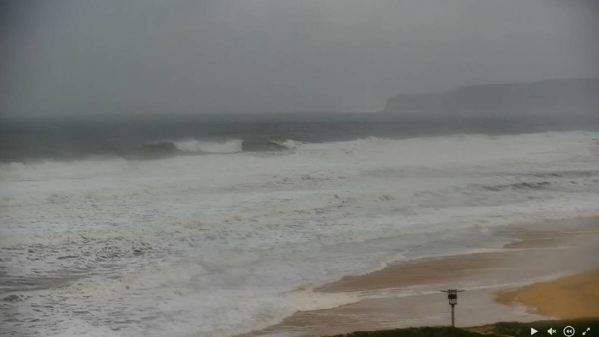 CHAOS THEORY: Torrents of whitewater running into Merewether, shot from the Dixon Park Surf Lifesaving Club webcam. Picture: Courtesy Surfline