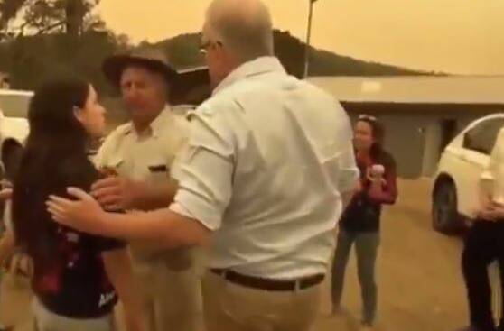 NO DEAL: A screen grab from the now famous January 2020 footage in which the woman tells Prime Minister Scott Morrison: "I'll only shake your hand if you give more funding to RFS [rural fire service]."