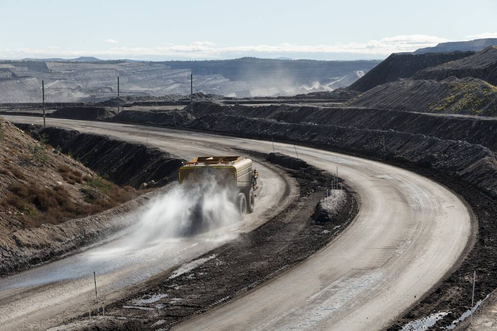 THE SOURCE: A section of the giant Mount Thorley/Warkworth open-cut mine near Singleton in the Hunter Valley. This picture of a water-truck damping down a haul road was taken last year. Picture: Max Mason-Hubers, Newcastle Herald