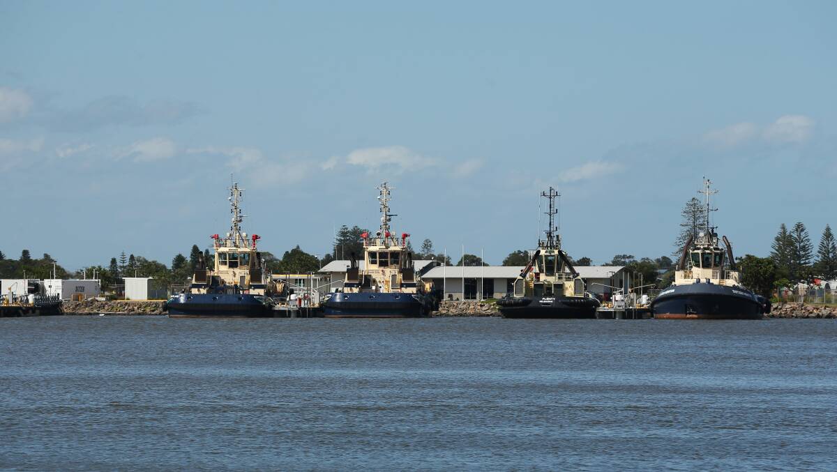 Four of Svitzer's nine Newcastle tugs berthed at the Eastern Basin Loader yesterday. Picture by Simone De Peak