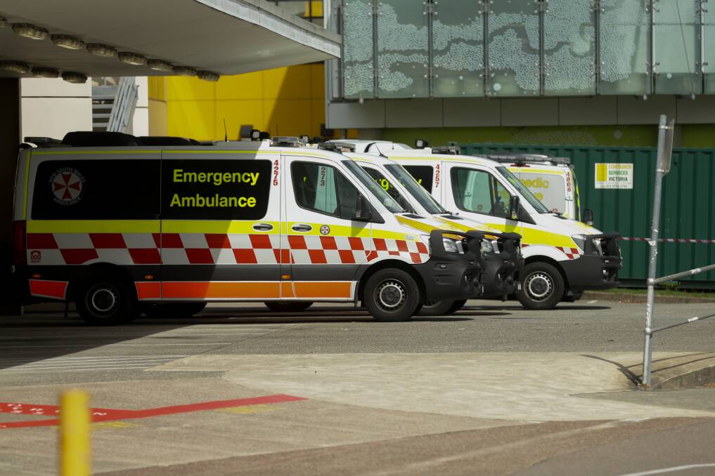DOOR DASH: Ambulances at John Hunter Hospital yesterday. Picture: Jonathan Carroll