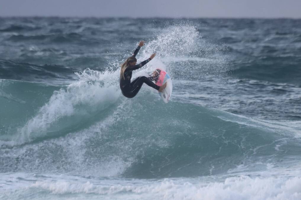 OFF THE TOP: Amelie Bourke wafts the fins out of the water, taking the challenge to the boys.