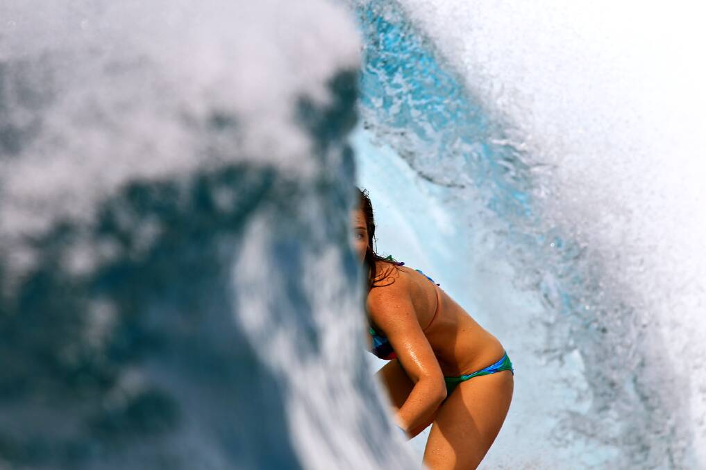 SUN SCREEN: Bec Woods hides in a Mentawai barrel. Picture: Simon 'Swilly' Williams