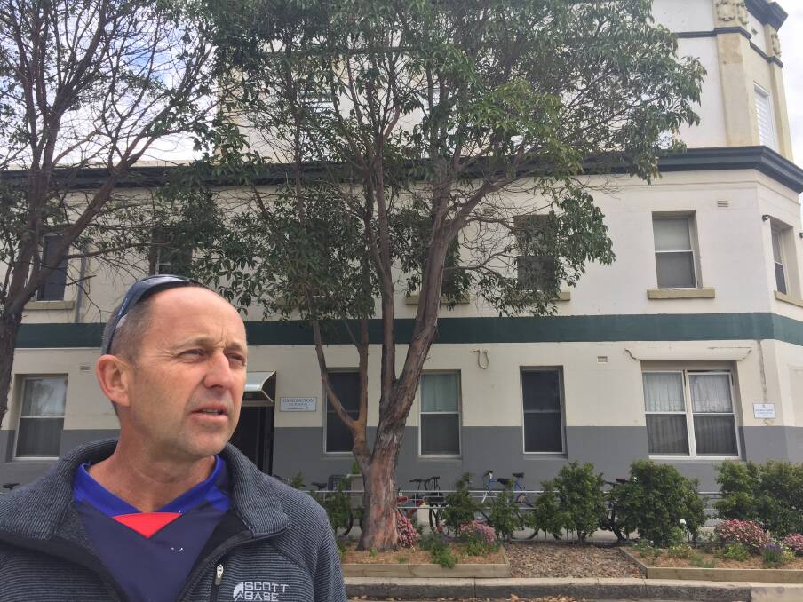 NOT A DEATH TRAP: Former Newcastle councillor Aaron Buman outside the former Carrington Inn, which he operates as a boarding house. He says it and another of his operations at Mayfield have been treated unfairly.