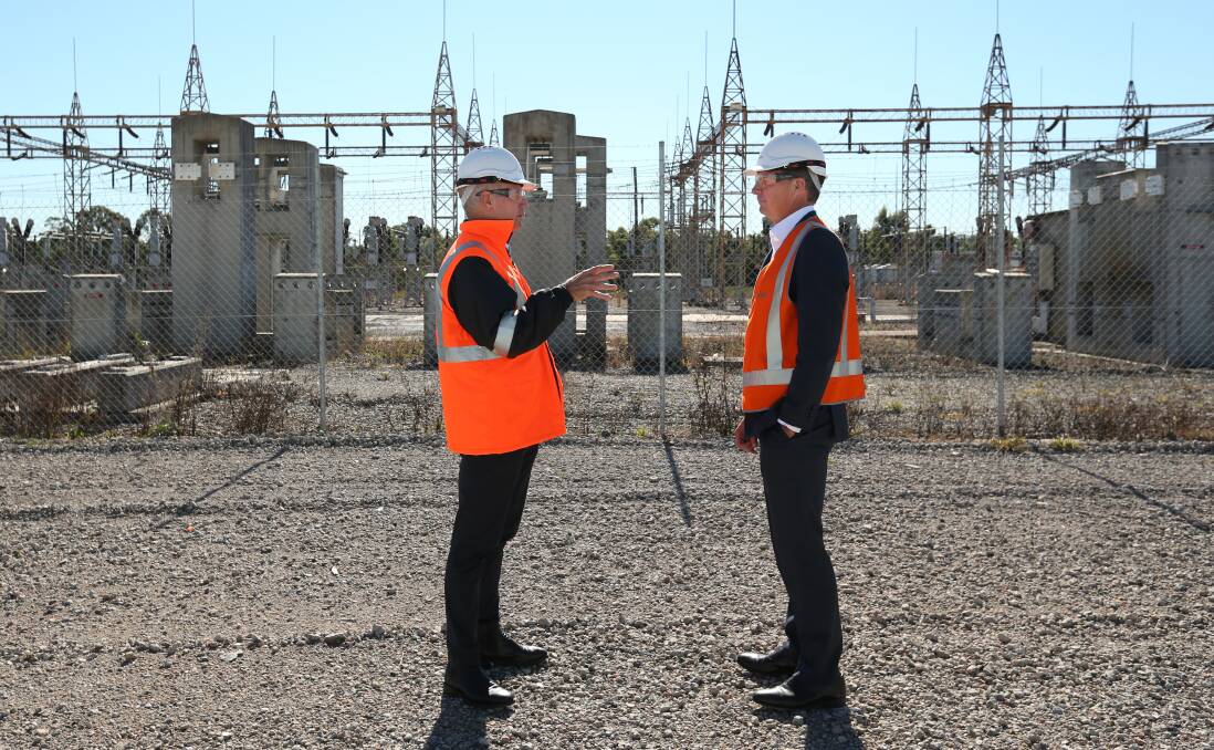 ZAPPED: Snowy Hydro chief executive and managing director Paul Broad at the former Kurri Kurri smelter site proposed for a gas-fired power station, with Energy Minister Angus Taylor in May this year.