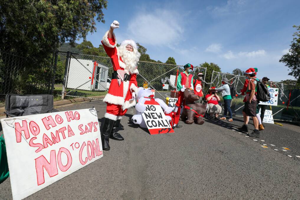 NOT EVEN SANTA CAN DO IT: Despite 'net zero by 2050' pledges, world coal consumption is predicted to hit record levels next year. Protesters earlier this month at Russell Vale Colliery at Bellambi. Picture: Adam McLean