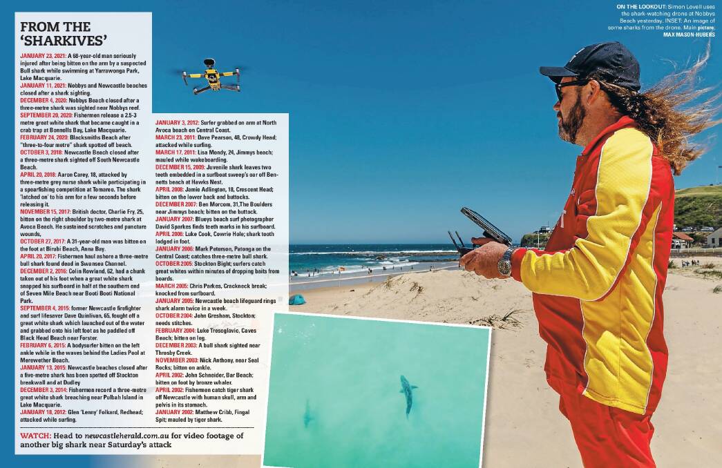 CLOSE EYE: Surf life saving volunteer and accredited drone pilot Simon Lovell in the sandhills next to the breakwall walk overlooking Nobbys Beach yesterday afternoon. The shark in the image is how they appear to the drone operator on screen. Picture: Max Mason-Hubers