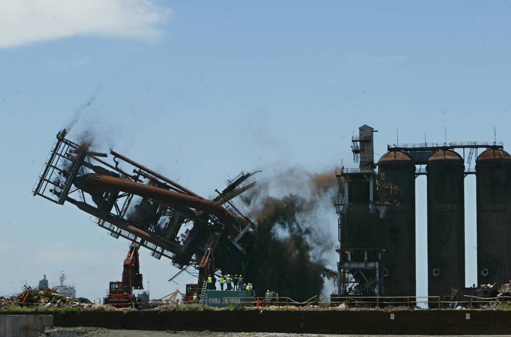 DOWN IT COMES: Demolition on the steelworks site in 2003. Picture: Darren Pateman