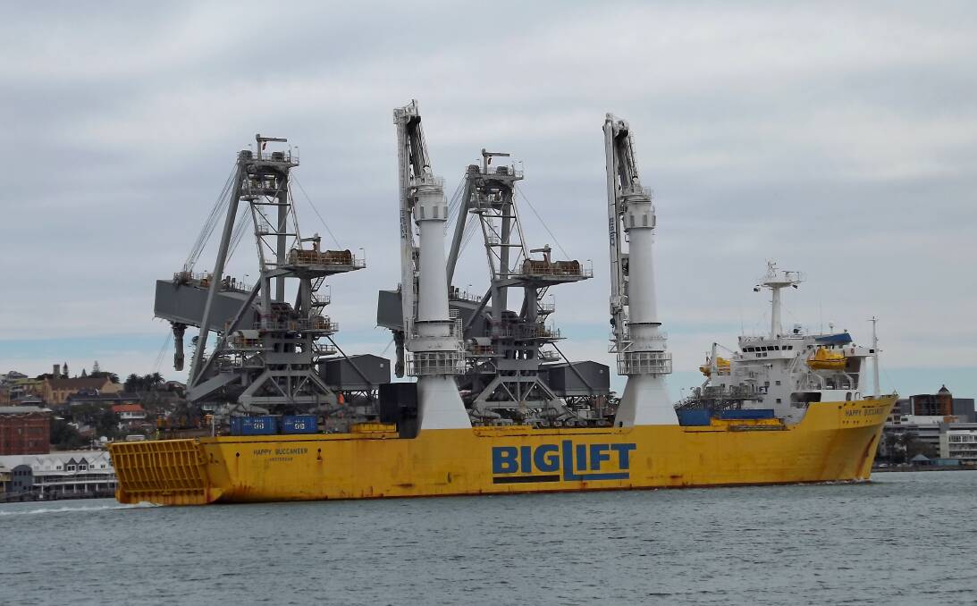 SHIP TO SHORE: Two new ship-loaders bound for the Carrington coal terminal on board the specialist "heavy lift" ship Happy Buccaneer in Newcastle harbour on Sunday. Picture: Richard O'Connor