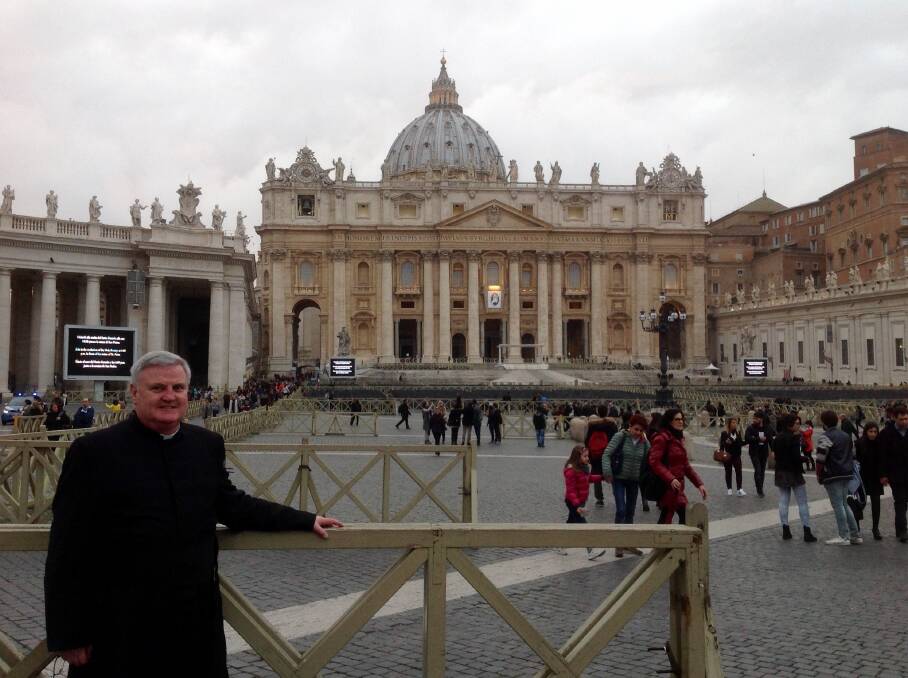 Power and the priest: Father Glen Walsh stands in St Peter's Square, Vatican City, in 2016, when he met Pope Francis.