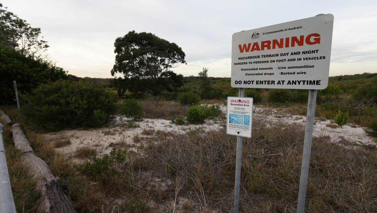 ALL QUIET: Boundary of the decommissioned Fern Bay rifle range, where hundreds of new homes are proposed. Pictures: Jonathan Carroll