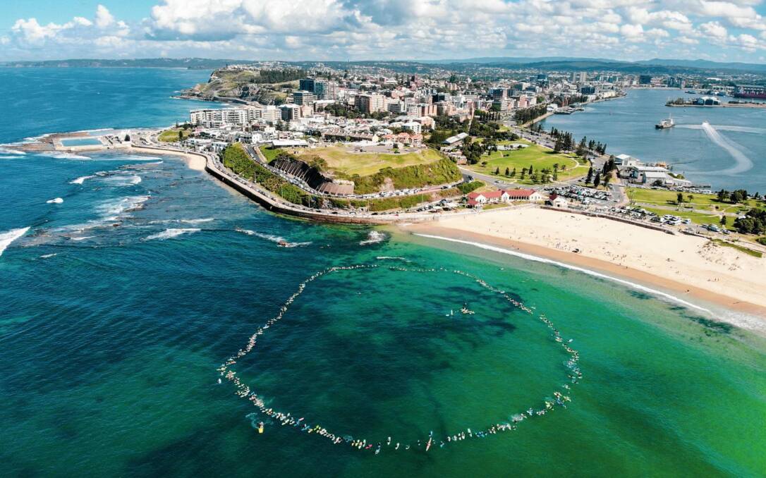 CIRCULAR ARGUMENT: Drone's-eye view of the hundreds of surfers who took part in Saturday's paddle-out calling for Petroleum Exploration Permit 11 (PEP-11) to be cancelled. Federal Resources Minister Keith Pitt says he is still considering the matter.