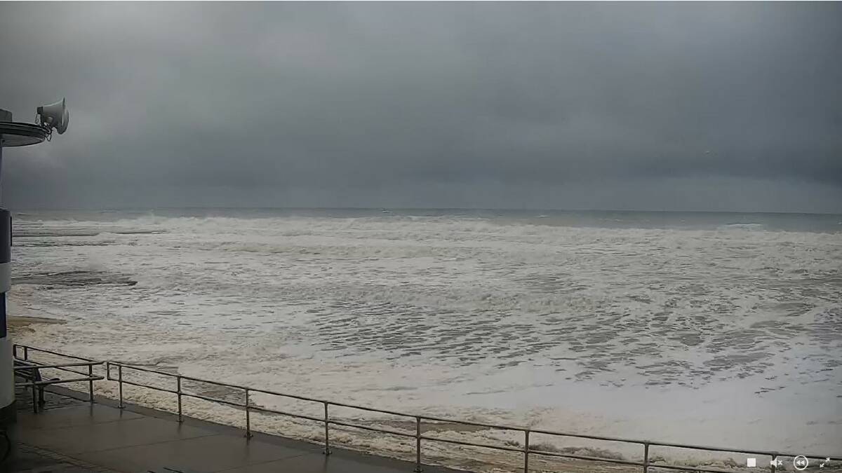 STIILL HIGH: The Newcastle beach camera pointing towards the 'map of the world' pool at the northern end of the beach, all but submerged more than two hours after the nominal top of the tide. Picture: Courtesy Surfline