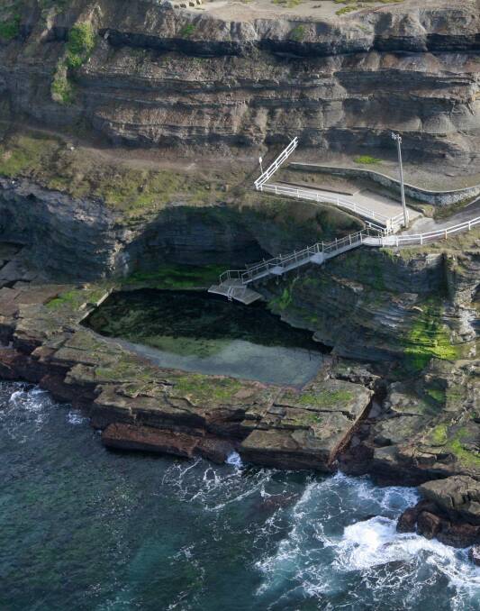 CARVED FROM ROCK: The Bogey Hole from the air, taken in 2013. The surrounding cliffs have been stabilised, enabling the pool to reopen for Christmas. Picture: Peter Stoop.