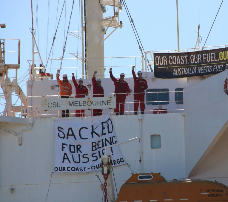 SOLIDARITY: Crew of the CSL Melbourne in the Port of Newcastle, photographed last week before their forced removal.