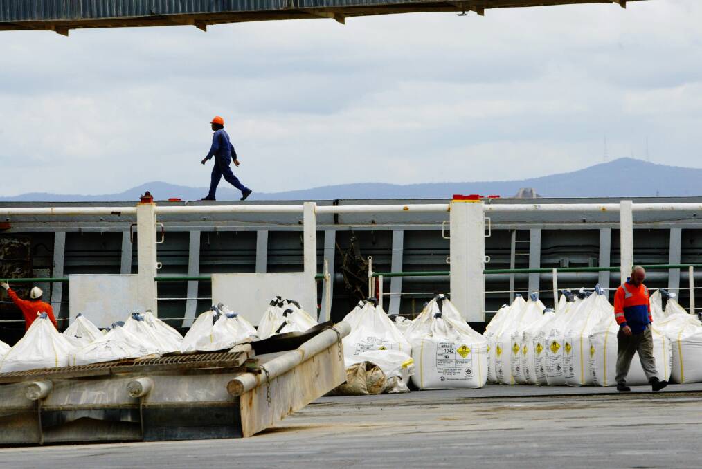 Ammonium nitrate being unloaded from a ship on Kooragang Island in 2004. Orica and others say the SafeWork proposals would mean many more such cargoes through the Port of Newcastle. Picture by Fiona Morris