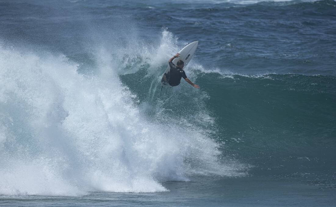  HARD HITTING: Luke Egan screams vertically into a powerful re-entry 'somewhere around Newcastle'. Surfing like this made the Novocastrian a fan favourite on the circuit and in surf movies. Picture: Peter 'Bosko' Boskovic