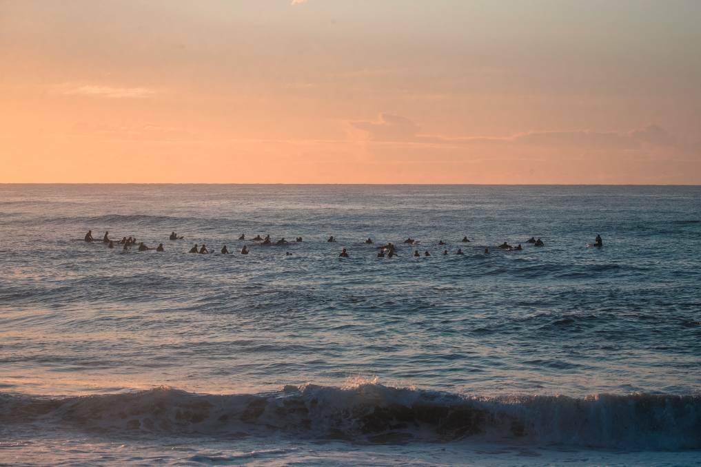 STRENGTH IN NUMBERS: A sunrise 'paddle out' organised by Another Sunrise to remember those lost to suicide, and to raise awareness of the importance of seeking help. Picture: James Miller