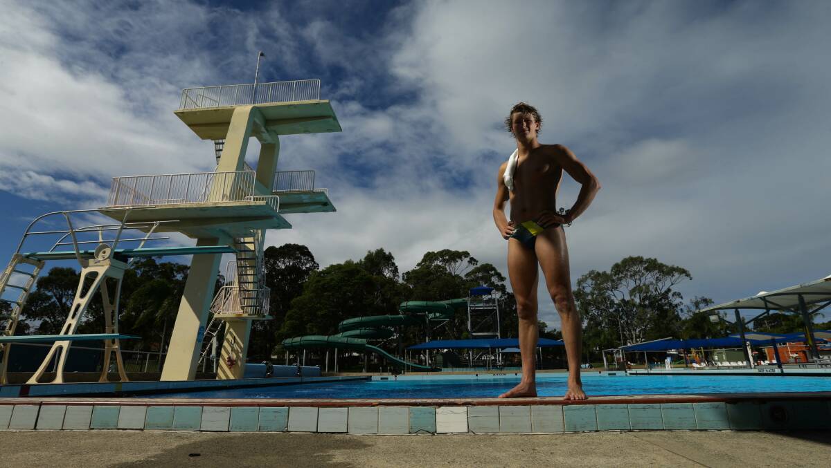 Newcastle diver Sam Fricker, who represented Australia at the 2020 Olympics, in front of Lambton Pool's signature diving tower in March this year. Picture by Jonathan Carroll