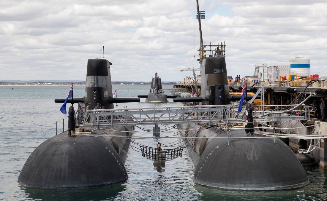 EAST COAST BOUND: A pair of Australian Collins class submarines, with the UK's nuclear-powered attack submarine HMS Astute, at Perth's HMAS Stirling Royal Australian Navy base in October last year. Picture: AAP
