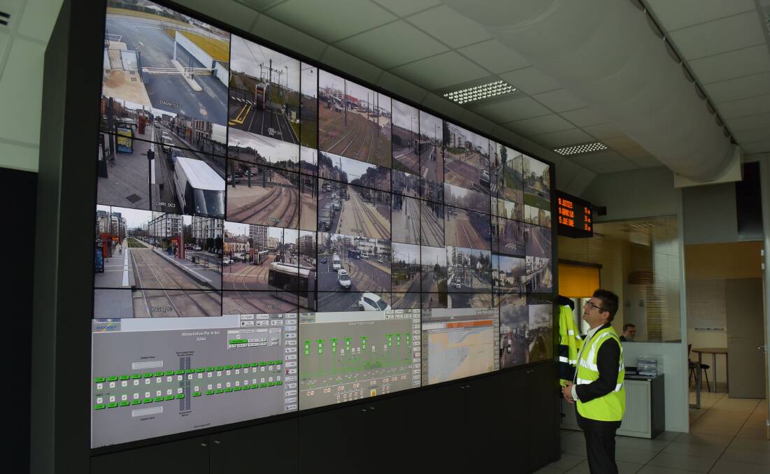 SYSTEM ON SCREEN: Keolis Downer's Andrew Fletcher touring a French Keolis light rail control centre in France in 2016. Picture: Ian Kirkwood